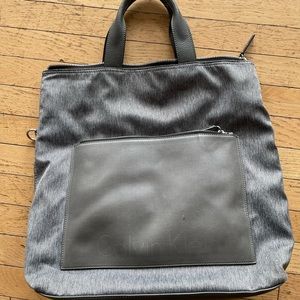 Used unisex CK bag. Was used for school! Missing shoulder strap! Leather handle